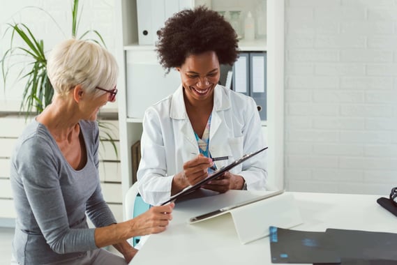 3469_A female doctor chats to an elderly patient 2