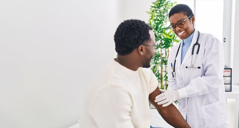 Doctor putting band aid at clinic